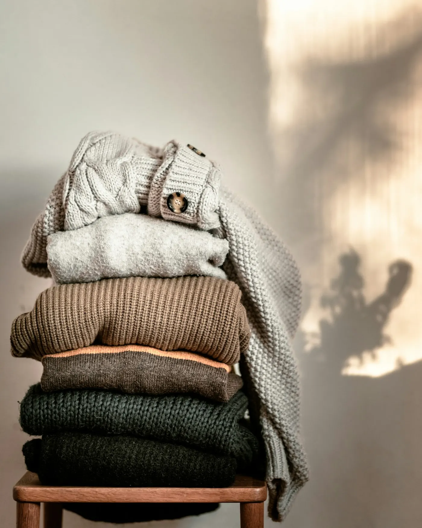 Folded knitwear in warm neutral tones